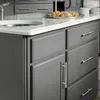 A close-up view of a gray kitchen island with drawers and a countertop. Produktbild-Vorschau