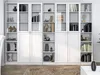 A white bookshelf filled with various decorative items and books. Produktbild-Vorschau