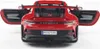 The rear view of a red Porsche 911 GT3 RS model car with its doors open. Produktbild-Vorschau