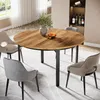 A round dining table with chairs in a well-lit room. Podgląd zdjęcia produktu