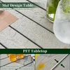 Close-up view of a table surface with water droplets, showing the slat design and PET tabletop material. Náhľad obrázku produktu