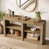 A wooden console table with decorative items in a well-lit room. Produktbild-Vorschau