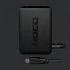 A black Noco USB-C charger and its cable are shown against a dark background. Produktbild-Vorschau