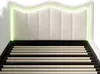 A close-up view of a bed frame with a padded headboard and integrated LED lighting. Anteprima dell’immagine prodotto
