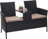 A black poly-rattan bench with cream cushions and a small table in the center, holding a fruit bowl and a drink. Produktbild-Vorschau