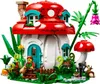A LEGO mushroom house with a minifigure in front. Voir les images du produit