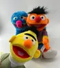 Three Sesame Street plush toys are arranged against a white background. Produktbild-Vorschau