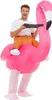 A man wearing an inflatable flamingo costume. Produktbild-Vorschau
