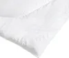 A close-up view of a white duvet with a subtle floral embroidery. Produktbild-Vorschau