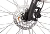A close-up view of a bicycle's front disc brake and part of the fork. Produktbild-Vorschau