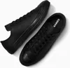 A pair of black leather Converse Chuck Taylor low-top sneakers are shown from a top-down perspective against a white background. Náhled obrázku produktu