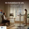 A man and a woman are using standing desks in a modern office or home setting. Produktbild-Vorschau