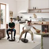 A boy and a man are sitting on stools in a modern kitchen and living room area. Anteprima dell’immagine prodotto