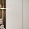 A close-up view of a wardrobe with a lamp and some decorative plants. Náhled obrázku produktu