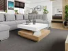 A modern living room with a large sectional sofa and a contemporary coffee table. Produktbild-Vorschau