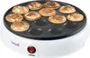A close-up, slightly angled view of a white poffertjes maker with mini pancakes cooking on its surface. Náhľad obrázku produktu