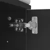 A close-up view of a cabinet hinge attached to a black cabinet door. Podgląd zdjęcia produktu