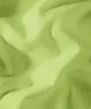 A close-up, abstract view of crumpled light green fabric. Produktbild-Vorschau