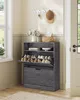 A shoe cabinet with shoes inside, placed in a hallway next to a window and a door. Produktbild-Vorschau
