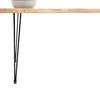 A close-up shot of a table leg and a bowl on a wooden tabletop. Podgląd zdjęcia produktu
