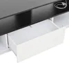 A close-up view of an open drawer in a white and black TV stand. Produktbild-Vorschau