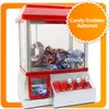 A candy grabber machine filled with candy and a toy car in the prize slot. Produktbild-Vorschau