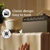 A Philips radio is placed on a shelf, with text overlays highlighting its features. Voir les images du produit