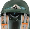 Close-up view of the top of a green backpack, showing a zippered pocket with a smartphone inside and straps and mesh detailing. Produktbild-Vorschau