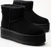 A pair of black UGG Classic Mini Platform boots are shown against a white background. Voir les images du produit