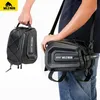 A person is holding and wearing a black bicycle bag. Produktbild-Vorschau