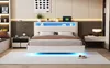 A modern bedroom with a white bed frame featuring LED lighting and a beige upholstered headboard. Anteprima dell’immagine prodotto