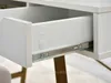 Close-up view of an open drawer on a desk, showing the drawer slides and interior. Voir les images du produit