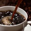 Coffee being poured into a cup. Produktbild-Vorschau