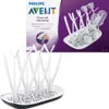 A product shot of a Philips AVENT bottle drying rack, with packaging in the background. Produktbild-Vorschau