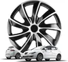 A large wheel cover is displayed prominently in front of two white cars. Produktbild-Vorschau