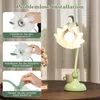 A collage of three images showing how to assemble a flower-shaped table lamp, with the assembled lamp shown on the right. Produktbild-Vorschau