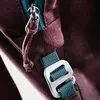 A close-up view of a backpack's zipper and buckle. Produktbild-Vorschau