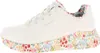 A side view of a white Skechers sneaker with a floral pattern on the sole and inner lining. Produktbild-Vorschau