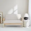 A beige two-seater sofa with wooden legs is shown in a minimalist room setting. Anteprima dell’immagine prodotto