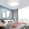 A bedroom with a bed, nightstand, and a ceiling light. Anteprima dell’immagine prodotto