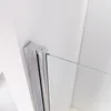 A close-up view of a shower enclosure hinge and glass panel against a white wall. Produktbild-Vorschau