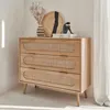 A wooden dresser with rattan drawer fronts is shown in a well-lit room with a sheer curtain in the background. Anteprima dell’immagine prodotto