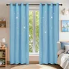 A bedroom scene with blue curtains with star patterns. Voir les images du produit