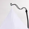 Close-up of a white fabric suspended from a black hook. Anteprima dell’immagine prodotto