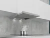 A modern kitchen with white cabinets and a concrete backsplash, featuring a Siemens range hood over a stovetop with a pot of steaming food. Produktbild-Vorschau
