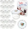 A set of glass jars with lids, a recipe book, and a decorative plate, all with a Christmas gingerbread theme. Produktbild-Vorschau