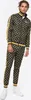 A man wearing a black and yellow patterned tracksuit. Náhled obrázku produktu