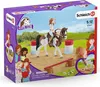 The image shows the packaging of a Schleich Horse Club Hannah's Western Riding Set, featuring illustrations of the toy set with horses and girls. Náhľad obrázku produktu