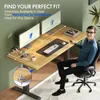 A man sitting at a wooden standing desk with two monitors. Anteprima dell’immagine prodotto