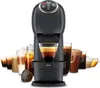 A black Krups Dolce Gusto coffee machine is shown with various coffee drinks in glasses in front of it. Produktbild-Vorschau